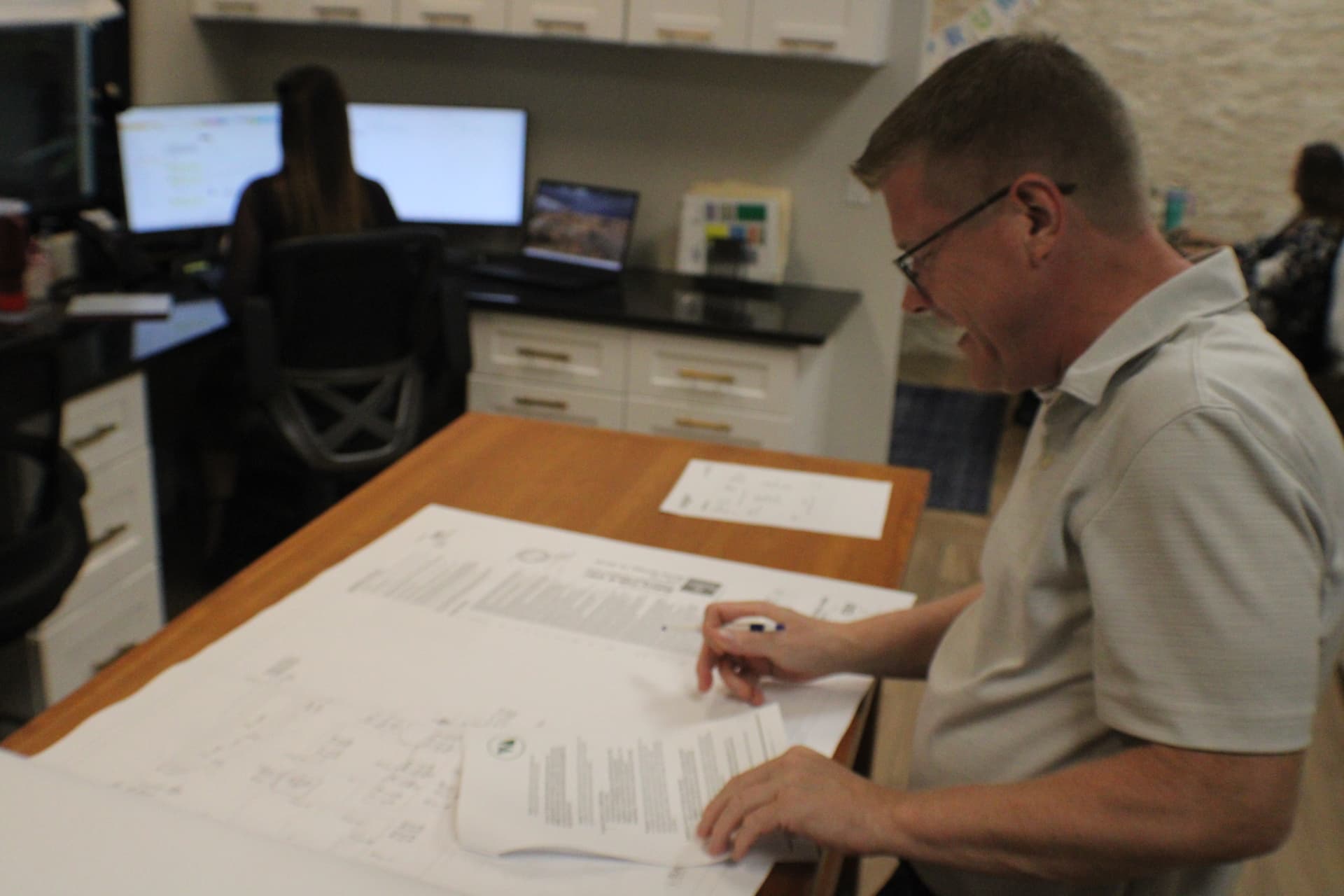 Elite Permits team working in the office